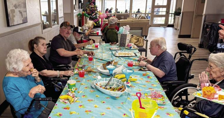 Residents at Madisonville Care Center enjoyed a tropical escape without leaving town during the facility’s luau event. The afternoon featured fresh fruit salad, waffle cone treats and festive Hawaiian decorations throughout the dining area COURTESY PHOTOS