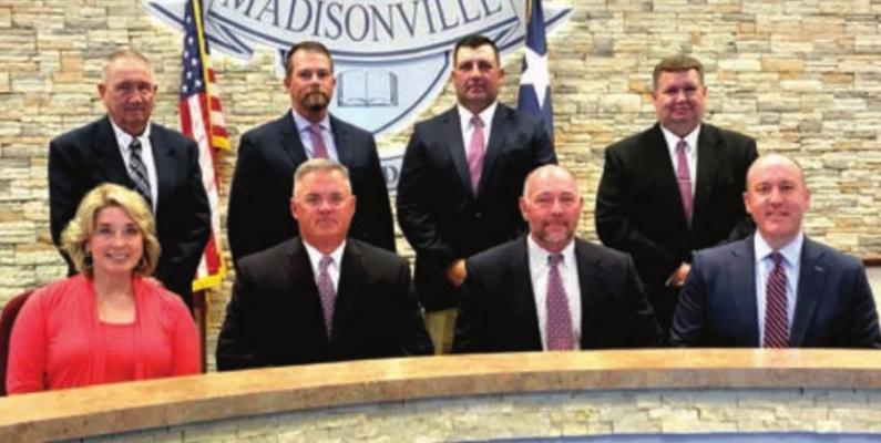 The Madisonville CISD School Board poses with Superintendent Keith Smith Monday. PHOTOS BY CAMPBELL ATKINS