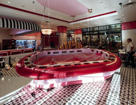 The large, pink, disc-shaped decorative fixture lies on the floor of the Madisonville Christmas Store cafe after falling from the ceiling on Saturday, Nov. 15. The incident injured two customers and prompted the cafe's closure for the remainder of the day. COURTESY PHOTO
