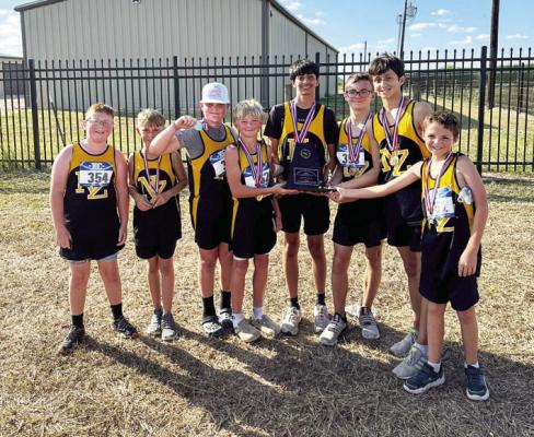 Members of the North Zulch junior high boys cross country team display their District 29-1A championship plaque following the Oct. 9 meet. COURTESY PHOTOS