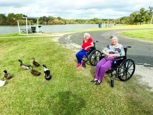 Madisonville Care Center residents enjoy outings and activities as part of the facility's wellness program. Staff members take residents to feed ducks at Lake Madison Park and host outdoor events including sprinkler days and dancing. PHOTOS COURTESY OF MADISONVILLE CARE CENTER