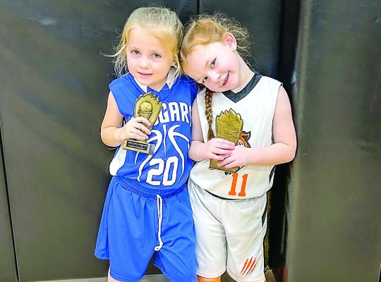 Lila Botello (left) playing for Leon and Ansley Wood of Centerville.