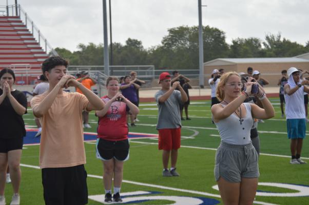 MUSTANG BAND TAKES THE FIELD FOR SILENT DRILL