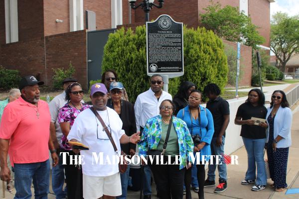 Six generations of Thomas Beck’s family stand beside his state historical marker Saturday, April 11 at the Madison County Courthouse. Beck was born into slavery in Kentucky around 1819 and served three terms in the Texas House representing Madison and Grimes counties.