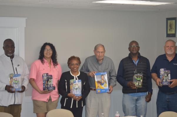 From left to right; Chris McGilbra, Melissa Hinojosa, Terri Davis, Bill Parten, Brady Taylor, Jessie Jaenicke, holding Toy Story toys at the Madisonville City Hall.