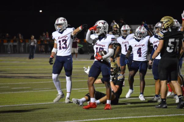 Madisonville’s Keidrick Moffett (10) and his teammates signal possession after the junior came away with an interception on the first drive of the game Friday. METEOR PHOTO BY CAMPBELL ATKINS
