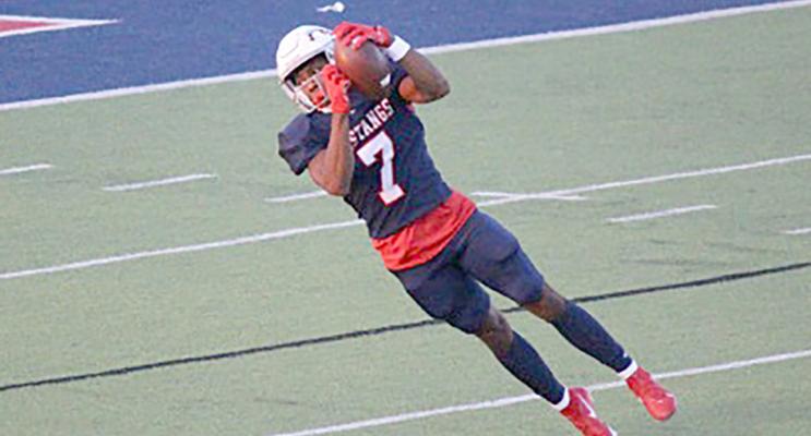 Number 7 Lorenzo Johnson catching the ball at last Friday’s homecoming game.