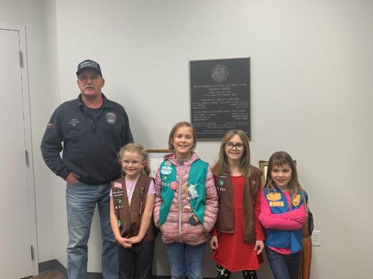 Troop no. 9504 delivers cookies to Madisonville Fire Department.