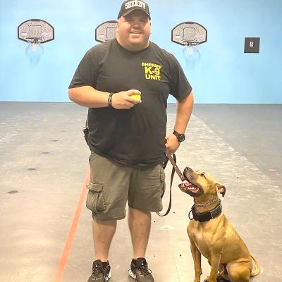 Sheriff Deputy Frank Mcintyre with the new Deputy K9 Maverick.