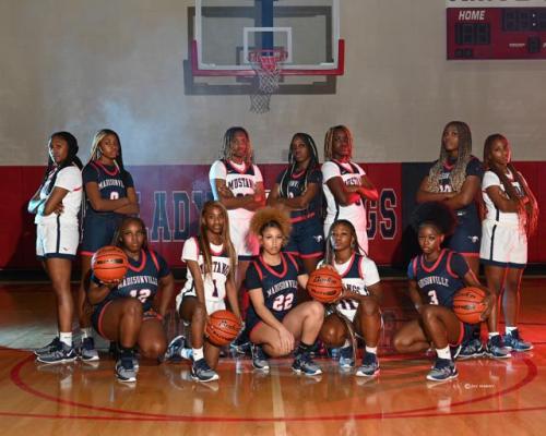 A team photo of the Madisonville Lady Mustangs basketball team. COURTESY PHOTO BY LOLA HARDY