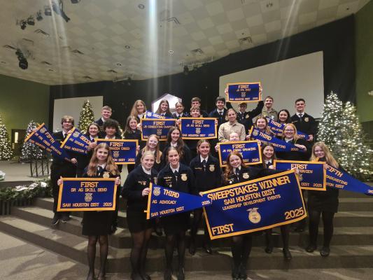 North Zulch FFA member Kaisley L. displays her fourth place banner from the junior creed speaking competition at the Sam Houston District Leadership Development Event Contest in Livingston on Friday, Nov. 14.