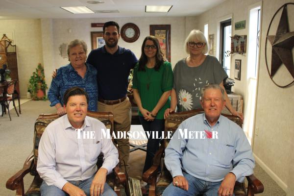METEOR PHOTO BY RICHARD SIRMAN Steven Stover (left) and Craig Stover, with Sheila Pierce (behind), Tyler Stover, Erin Ferguson and Tammy Driskell at Stover and Crouch Insurance Agency, 716 S. Madison St.