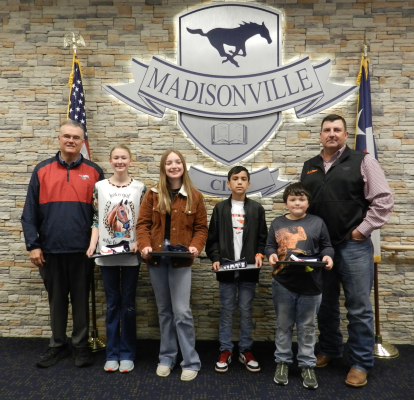 Staff members who were recognized for Feb. Coach Melvin Williams and Mrs. Cindy Alvarado, who are standing between Dr. West &amp; Trustee Bo Williams COURTESY PHOTOS