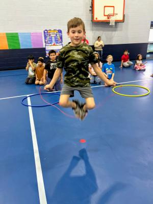 Ollie Johnson jump ropes in the gymnasium.