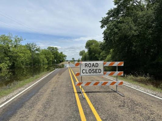 The road closed sign on Farm to Market 2548 on Friday, May 17, following flooding from the previous night’s storms. METEOR PHOTO BY RICHARD SIRMAN