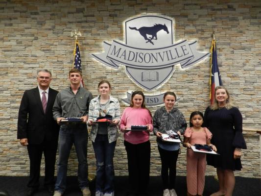 Pictured, left to right: MCISD Superintendent Dr. Keith West, High School student Ty Williams, Junior High student Hallee Jo Wiggins, Intermediate student Avery Cansler, Intermediate student Ashlyn Cansler, Elementary student Kimberly Avelar, and MCISD Board Secretary Zingara Manning. Courtesy photos