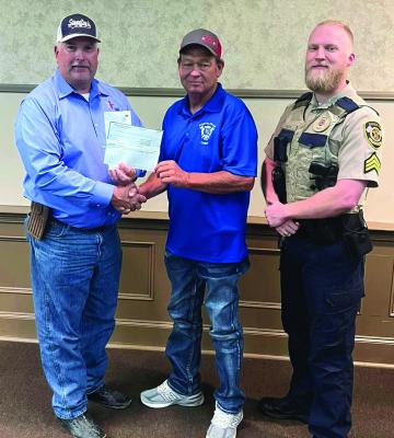 Kevin Counsil of Madison County Farm Bureau (left) presents a donation check to North Zulch Volunteer Fire Department Chief Tony Clay (center) and MCSO Sgt. Klute Kyle, also an NZVFD member, on Friday, Sept. 20. The Farm Bureau's ongoing support bolsters local emergency services in the community. COURTESY PHOTO