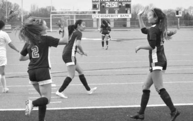 Jaylen Downard (2) high fives Yesenia Aceves after a goal in Madisonville’s Friday win over Rockdale. The Lady Mustangs advanced to the semifinal round of their own tournament at MHS over the weekend. CAMPBELL ATKINS
