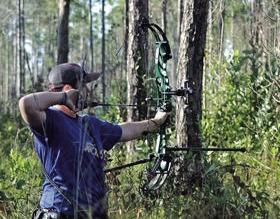 Zachary Rebstock is shooting his bow.