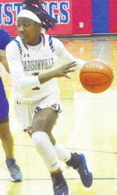 CAMPBELL ATKINS Kayla Dickey drives to the basket during a Madisonville home game last season.