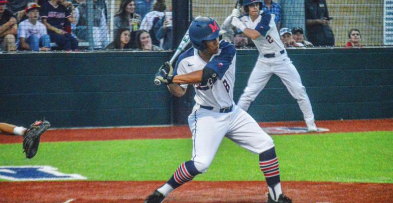 Cameron Thrower turns into a pitch during a Mustangs home game at MHS. CAMPBELL ATKINS