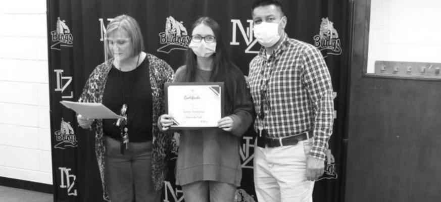 North Zulch High School Student of the Month Anna Thatcher poses with Principal Janie Pope and Assistant Principal Pete Martinez at the district’s monthly meeting Monday. (Not pictured: Junior High Student of the Month Kamryn Piatti)