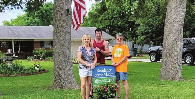 Yard of the Month 1006 Collard, home of Carolyn Warren. Pictured (left to right): Jimbo Richards, Jerrie Dimaria and Kay Welch. COURTESY PHOTO