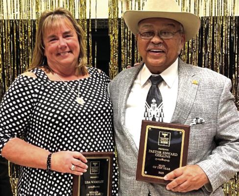 Pastor Edward Collins (right) and Lisa Wamsley (left) at the Seton Center with their respective man and woman of the year plaques