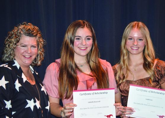Gabrielle Bracewell (middle) and Landri Lee (right) with their scholarship and sponser on the left