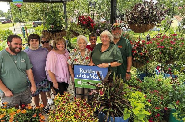 METEOR PHOTO BY RICHARD SIRMAN Keep Madison County Beautiful honors the Jarrett residence. From left: Derek Wiggins, Christian Wilson, Lori Wilson, Crystal Callaham, Joyce Jones, Kay Welch, Jackie Jarrett and Jack Jarrett.
