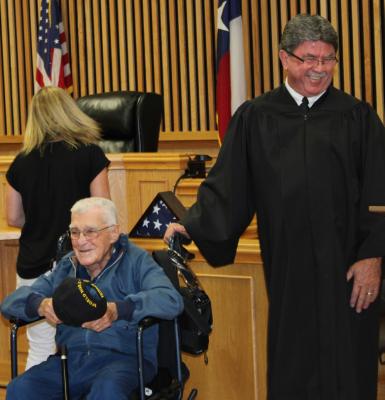Mr. Burke Landry giving his speech, thanking everyone for showing up, making Judge Clark Osborne chuckle with delight.