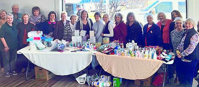 Members present at January MCRSP beside the many items donated to TLC