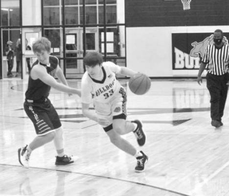 Emory Broussard led the North Zulch basketball team with 17 points in a Friday victory over Richards to clinch a playoff spot for the Bulldogs. CAMPBELL ATKINS
