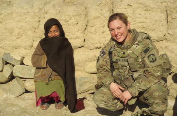 Erica Greene during one of her deployments in the Army posing for a picture with a child from Paktika Province, Afghanistan in 2012