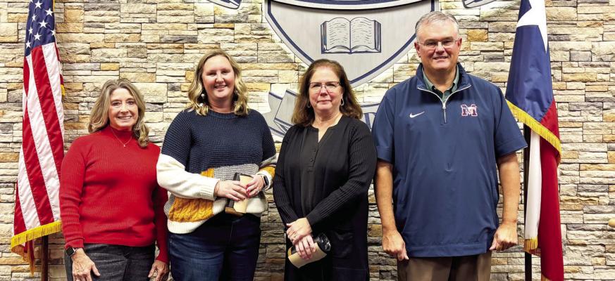 Madisonville Consolidated Independent School District board member Zingara Manning (left), December Staff of the Month recipients Ashley Gerhart and Beth Parr from the Intermediate campus, and Superintendent Keith West gather for recognition during the board's Monday, Dec. 8 meeting. COURTESY PHOTOS