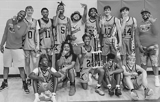 The Senior boys’ team at the Mexia National Tournament with their first-place trophy. COURTESY PHOTOS
