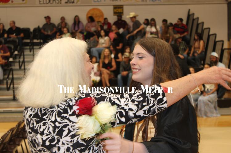 North Zulch valedictorian Abree Schramm, right, embraces FCCLA teacher Jane Dill during the Presentation of Roses Friday, May 22 at the North Zulch High School commencement ceremony at the North Zulch Gymnasium. 