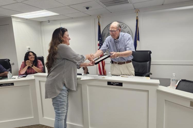 Mayor Bill Parten handed Patricia Hardy her certificate of appreciation at the city council meeting on Monday, May 13.