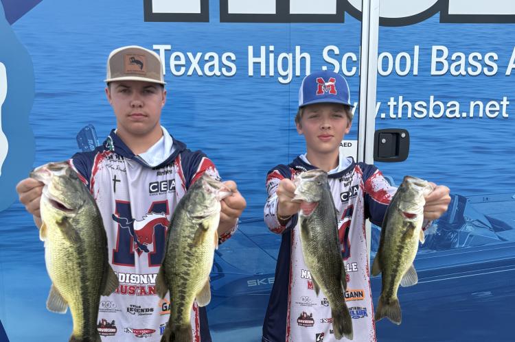 PHOTO COURTESY OF SABRINA BOYD Kaiden Rowley (left) and Cody Lawrenz with their catches at a Texas High School Bass Association weigh-in.