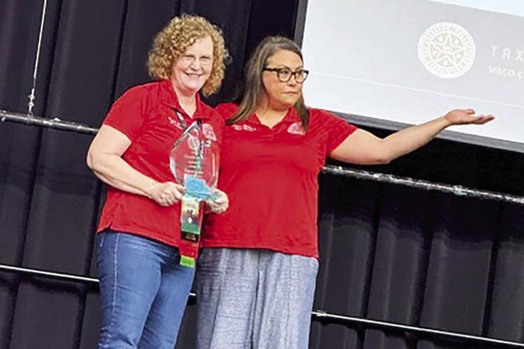Madison County Tax Assessor-Collector Karen Lane (left) holds the President’s Award alongside Randall County Tax Assessor-Collector Christina McMurray, the association’s president, at the Tax Assessor-Collectors Association of Texas conference in Waco. COURTESY PHOTO